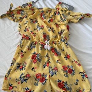 A yellow/red/blue flower romper